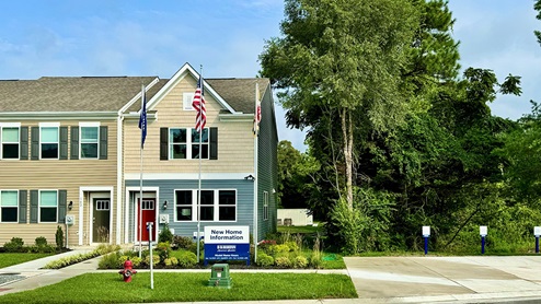 Riverwalk Terrace exterior model of Jefferson townhomes.
