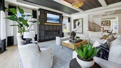 open concept living room facing linear fireplace