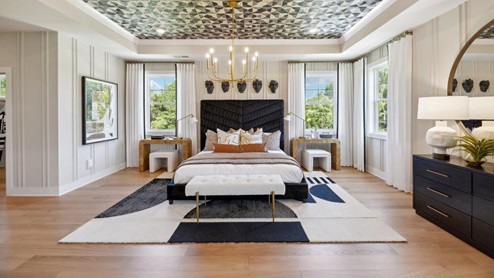 master bedroom with tray ceiling