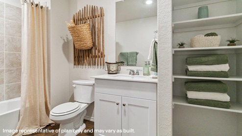 Full bathroom at the top of the stairs.