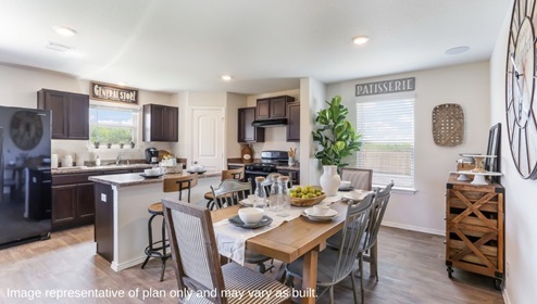 D.R. Horton san antonio solana ridge near lackland air force base the swift 1625 square feet open concept eat in kitchen with brown cabinets and kitchen island flows to dining area