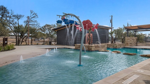 Bulverde Texas DR Horton Homes Copper Canyon New Construction Homes outdoor splash pad with water features and covered pavilion