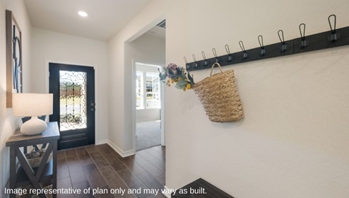 Bulverde Texas DR Horton Homes Copper Canyon 1796 square feet The Irvine one story New Construction Homes front entryway with hard surface flooring console table with table lamp hallway bend with wall hooks and wicker basket