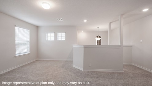 Bulverde Texas DR Horton Homes Copper Canyon Llano floor plan 2555 square feet two story New Construction Homes upstairs loft or game room with carpet flooring decorative half wall large windows for natural lighting chandelier light fixture over stairs