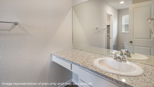 DR Horton San Antonio Laurel Vistas the carswell floor plan 1180 square feet main ensuite bathroom with single vanity sink, granite counter top and mirror
