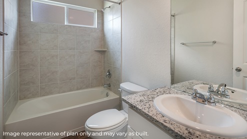DR Horton San Antonio Laurel Vistas the carswell floor plan 1180 square feet secondary full bathroom with tub and shower combo, toilet, and single vanity sink with shaker style cabinets