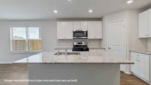 kitchen with spacious kitchen island, deep single basin sink, plenty of cabinetry and stainless steel appliances