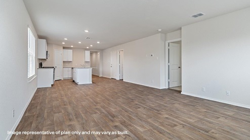 spacious open concept living room and dining area flowing to kitchen with hard surface flooring throughout