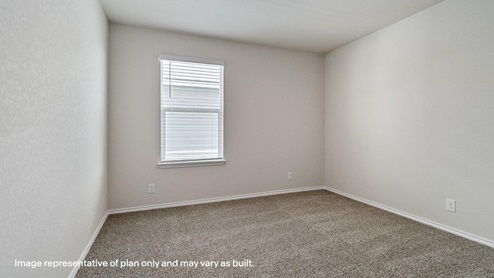 fourth bedroom with window and carpet
