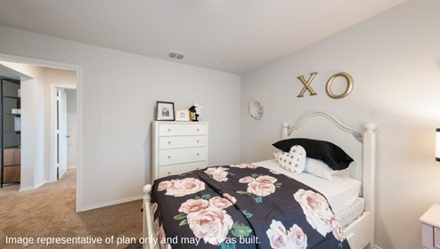 Secondary bedroom with quality carpet, window and closet.