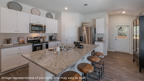 DR Horton Von Ormy Preserve at Medina the diana floor plan 1535 square feet kitchen with large kitchen island granite countertops stainless steel appliances and white cabinetry