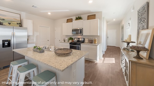DR Horton Von Ormy Preserve at Medina the hanna floor plan 2042 square feet kitchen with white cabinets stainless steel appliances granite countertops and spacious kitchen island with sink and barstools