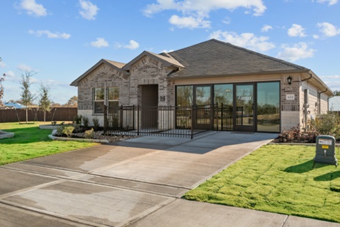 Rockbridge Model Home exterior with driveway and sales office.
