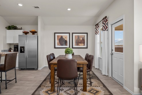 Rockbridge Model Home open-concept dining room with table and windows.