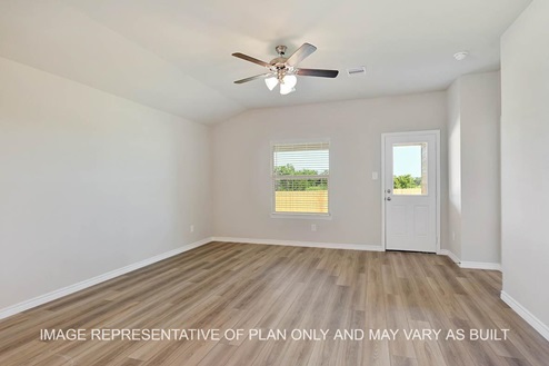 Richmond living room with view to back door and vinyl plank flooring.