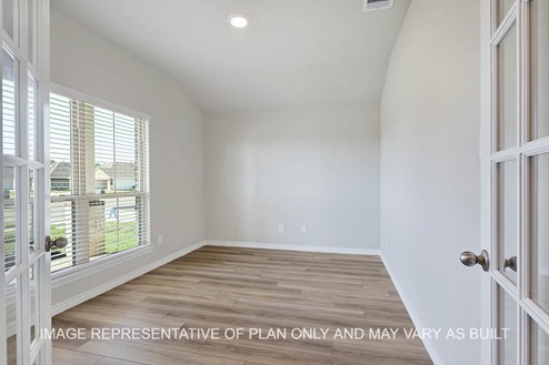 Richmond study with vinyl plank flooring and windows.