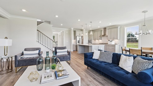 Open concept main floor combines upgraded kitchen, casual dining, and great room