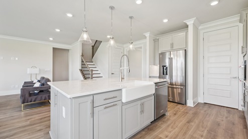 The kitchen sink and dishwasher come installed into the kitchen island
