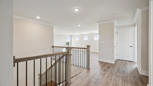 Upstairs hallway with hard flooring