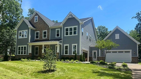 An estate home sitting on a 10-acre homesite in Nokesville, featuring storm siding