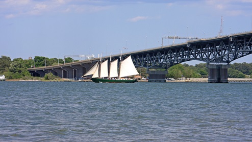 sailboat under coleman bridge