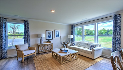 Living room with large windows and wood floors