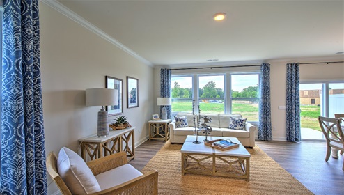 Living room with large windows and wood floors