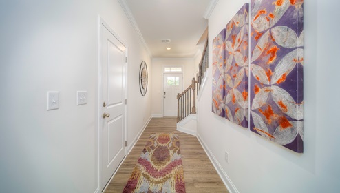 Welcoming foyer, view of hallway and front door
