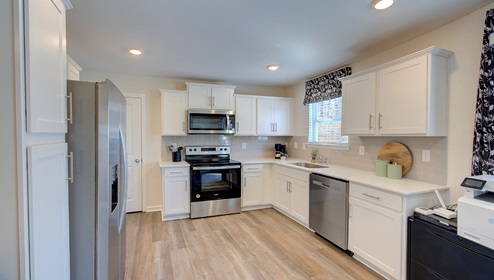 kitchen with white cabinets and stainless steel appliances