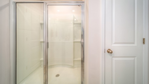 Primary bathroom with glass door standing shower