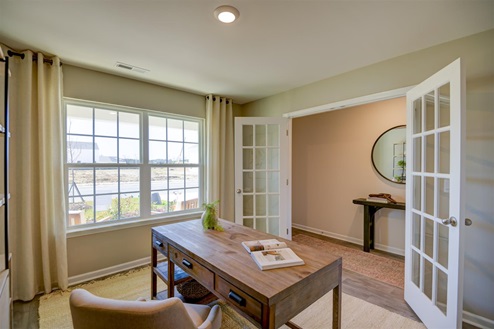 Office with vinyl floors and French doors