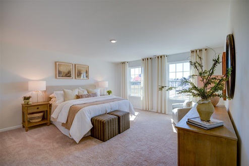 bedroom with carpet and natural light