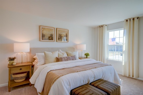 bedroom with carpet and natural light