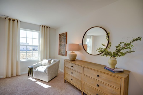bedroom with carpet and natural light