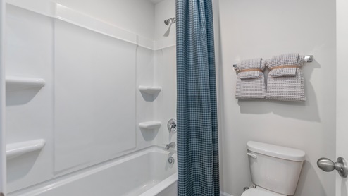 bathroom with tub shower combo