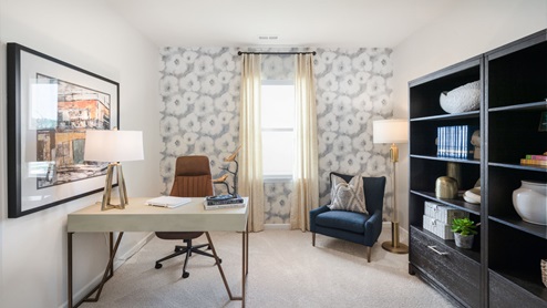 Study with natural lighting and carpet flooring