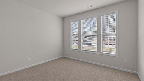 Secondary bedroom with three windows