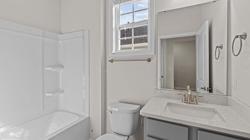 Secondary Bathroom with tub shower combo