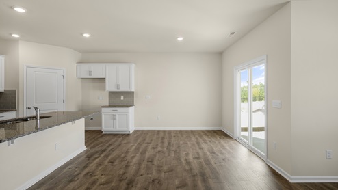 Dining area with a sliding glass door leading to back patio