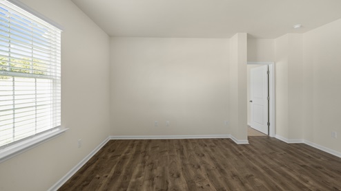 Living room with revwood flooring and large window