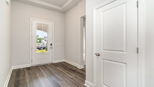 foyer with vinyl plank flooring