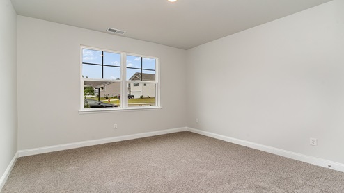 front bedroom with carpet