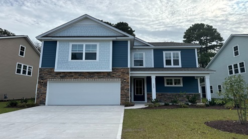 two story home with hardie and brick siding