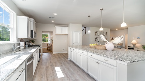 kitchen with white cabinets and granite countertops