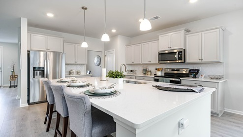 kitchen with gray cabinets and granite countertops