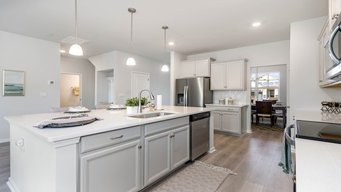kitchen with gray cabinets and granite countertops