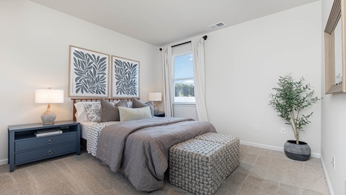 Cali secondary bedroom with carpet