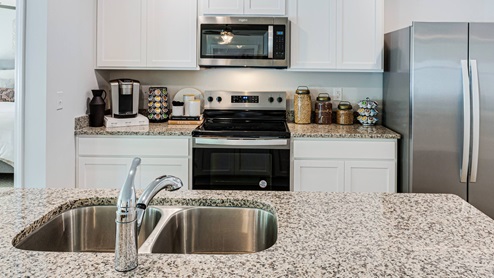 Our homes feature open floorplans that combine style and functionality. You'll find sleek granite countertops, islands, and shaker-style cabinets in the kitchen. For that modern touch, you'll also get stainless-steel appliances, dishwasher, and microwave. Smart home technology is included, providing convenience and efficiency at your fingertips. Jacksonville, North Carolina is a thriving Military town with plenty of southern charm. Home to Marine Corps Base Camp Lejeune and a vibrant coastal community. This bustling city offers a perfect blend of military heritage, outdoor recreation, and family-friendly attractions. With public access to Onslow Beach and North Topsail Beach, you are sure to get your fix of sun! If the ocean isn’t your thing, come and shop at Jacksonville Mall, or explore the natural beauty of Hammocks Beach State Park nearby. With a growing population and strong economic outlook, Jacksonville is an ideal destination for military families, young professionals, and retirees alike.