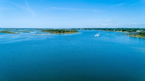 Your new residence is only a few minutes away from peaceful beaches, convenient amenities, and charming dining venues. Nearby, you'll find Morehead City, host to the renowned Big Rock Blue Marlin Tournament, one of the largest and most prestigious events on the Eastern Seaboard. Additionally, you are in proximity to historic Beaufort, Shakleford Banks, Emerald Isle, and Atlantic Beach.