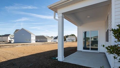 Step outside onto your covered porch to enjoy the night sky. With its open layout and sleek design, the Aria is ideal for anyone seeking comfort and modern features.